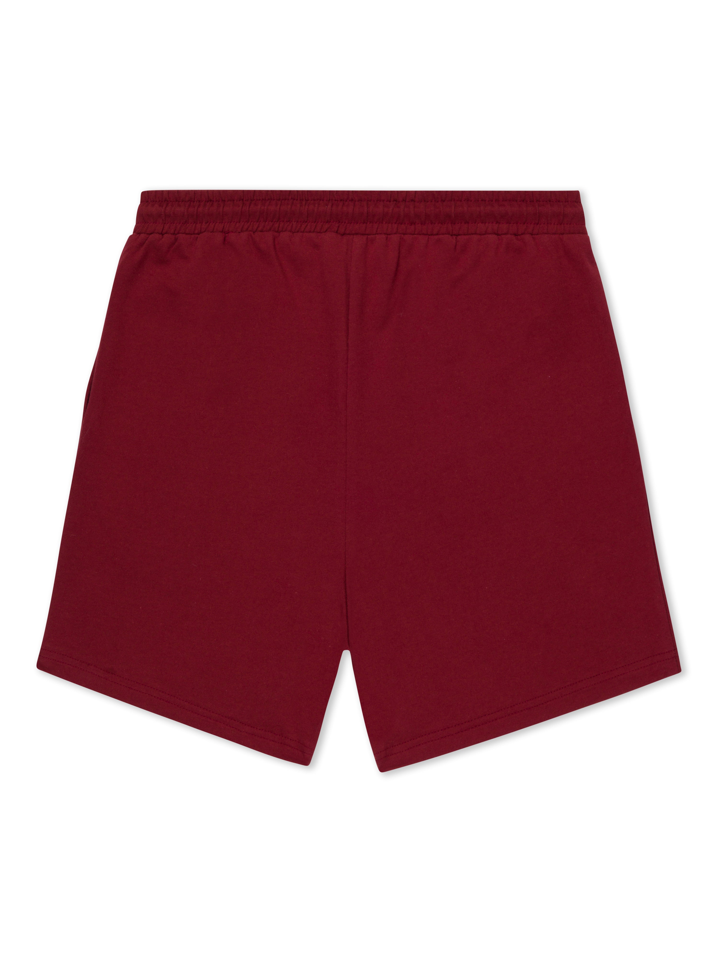 the back of a pair of red cotton gym shorts made of natural fibres
