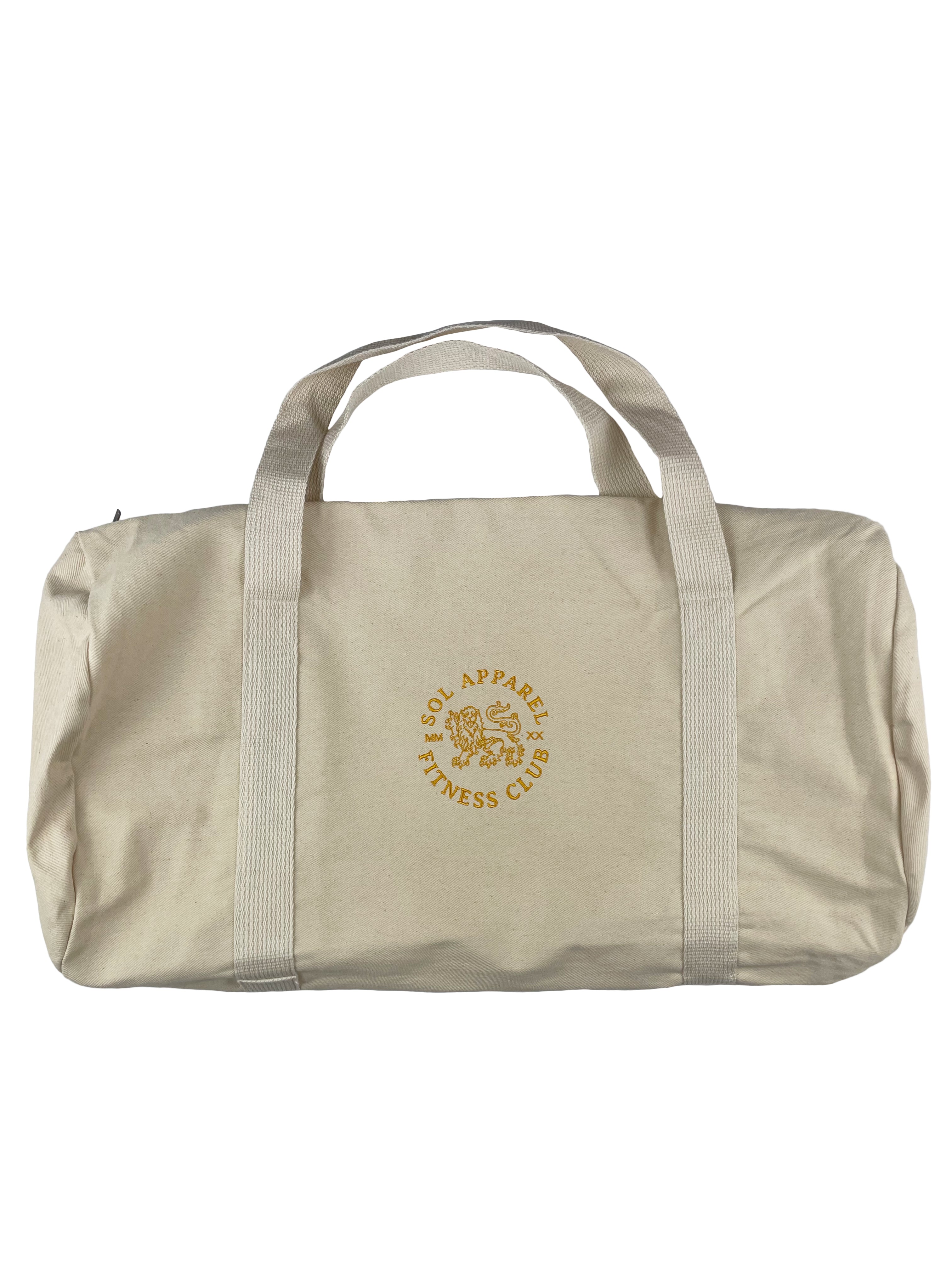 natural colored all purpose duffel bag with golden lion and text embroidered on the side
