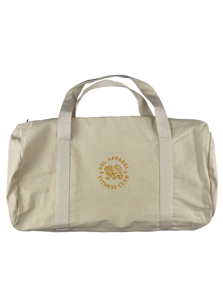 natural colored all purpose duffel bag with golden lion and text embroidered on the side